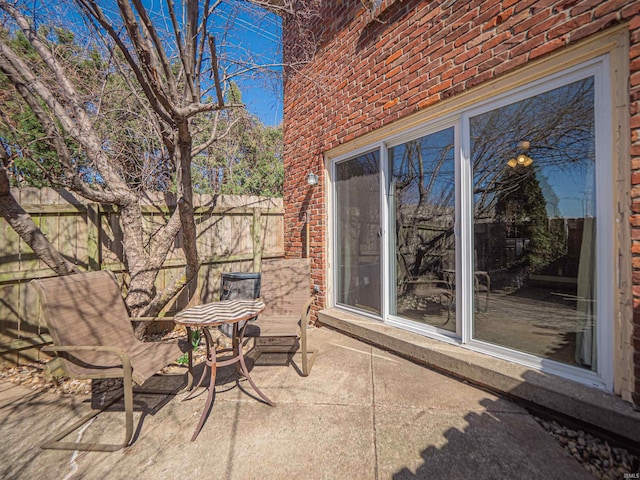 view of patio featuring fence