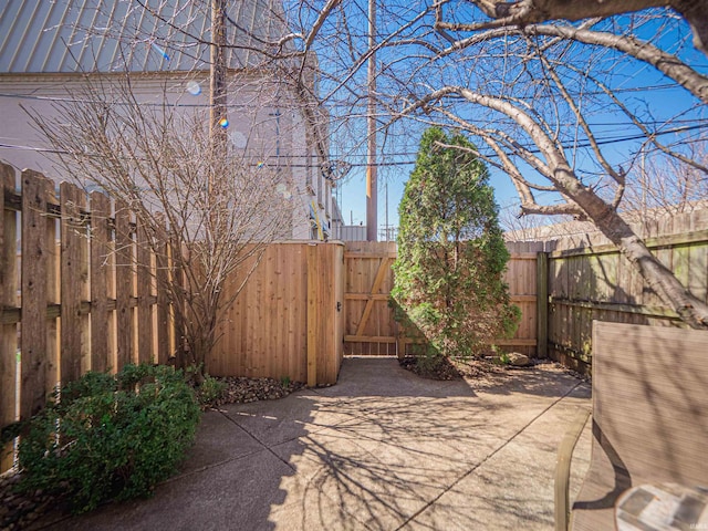 view of patio / terrace featuring a gate and fence