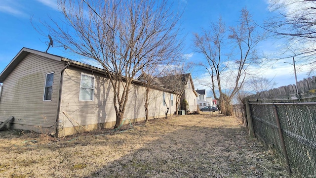 view of side of property with fence