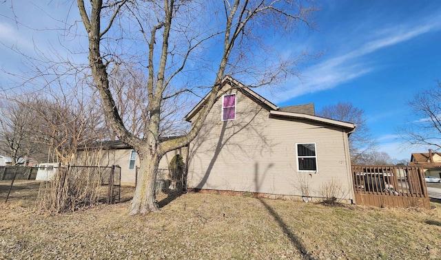 view of property exterior with fence