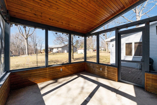 unfurnished sunroom with wooden ceiling and vaulted ceiling