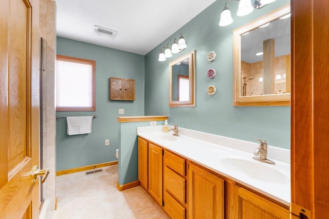 bathroom with a sink, visible vents, and toilet