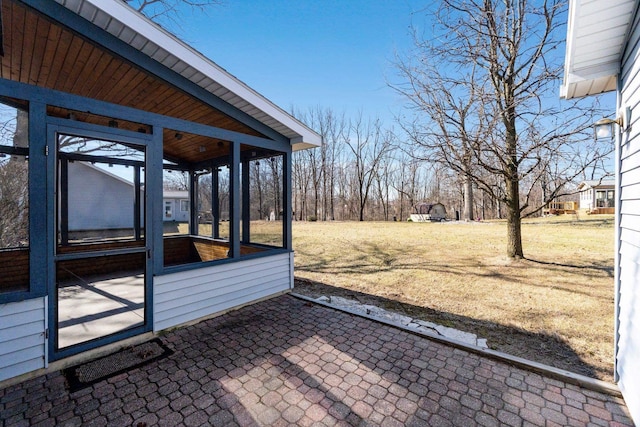 view of patio / terrace with a sunroom