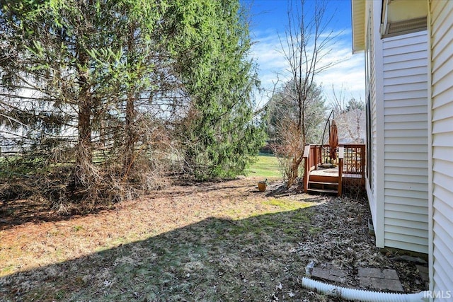 view of yard featuring a wooden deck