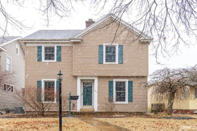 view of front of house with a chimney