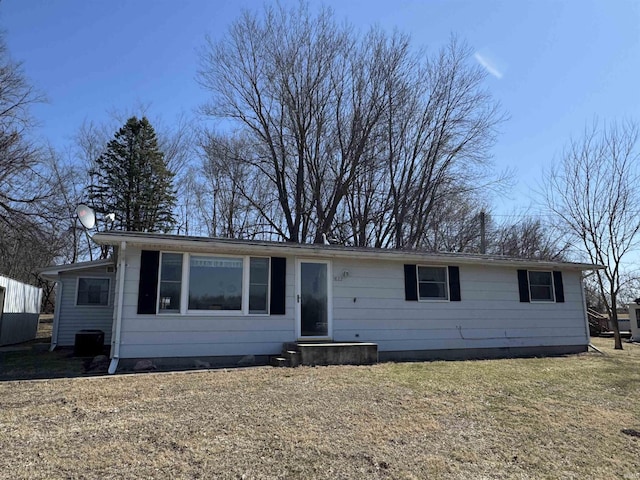 ranch-style home with a front lawn