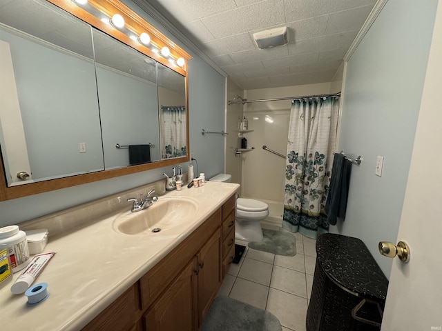 full bath with toilet, ornamental molding, vanity, and tile patterned flooring