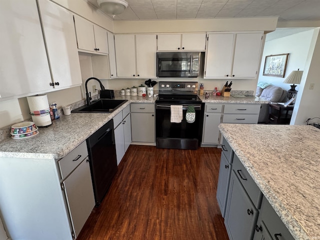 kitchen featuring a sink, light countertops, dishwashing machine, electric stove, and dark wood-style flooring