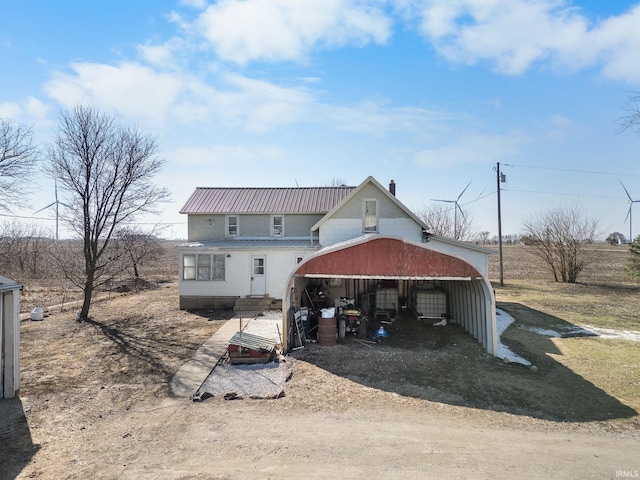 back of property featuring a garage