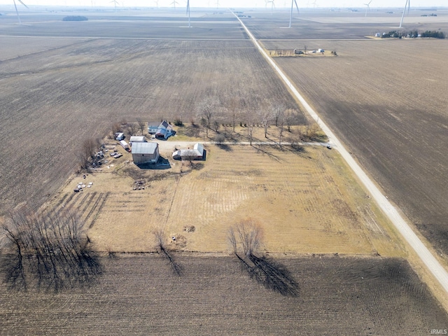 birds eye view of property with a rural view