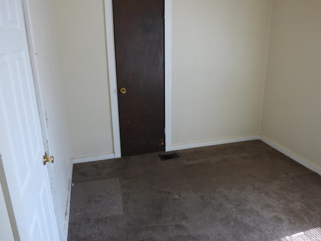 unfurnished bedroom featuring visible vents, carpet floors, and baseboards