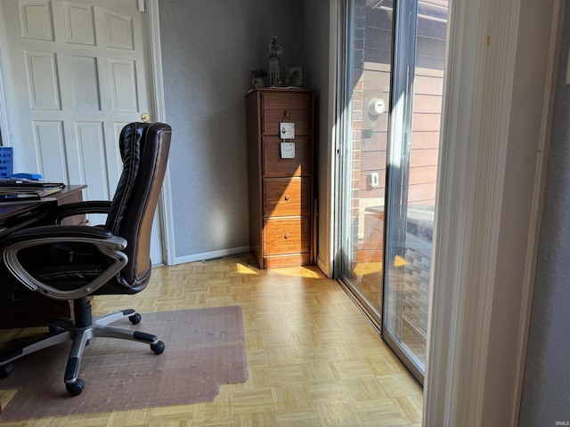 office space with baseboards and plenty of natural light