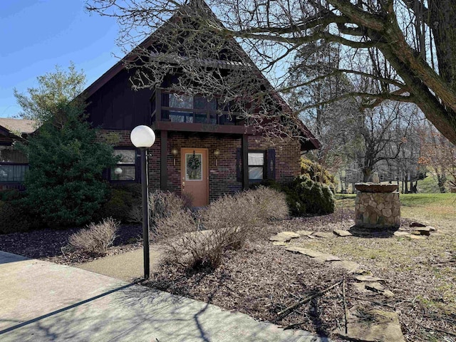 view of front of house featuring brick siding