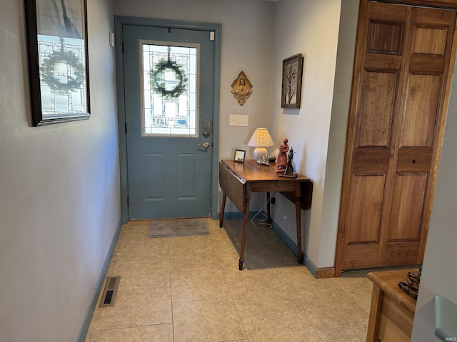 entrance foyer featuring baseboards and visible vents