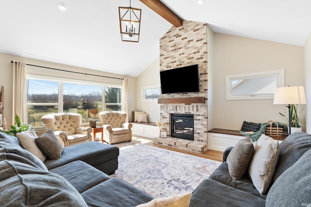 living area featuring beam ceiling, a brick fireplace, high vaulted ceiling, and wood finished floors