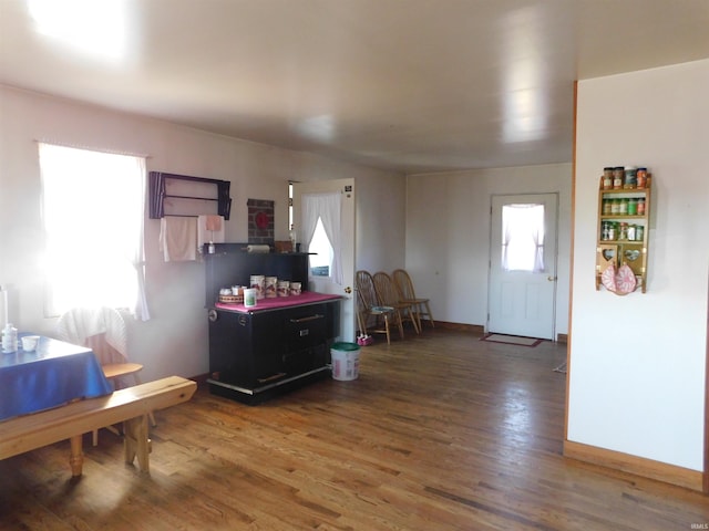 kitchen with baseboards and wood finished floors