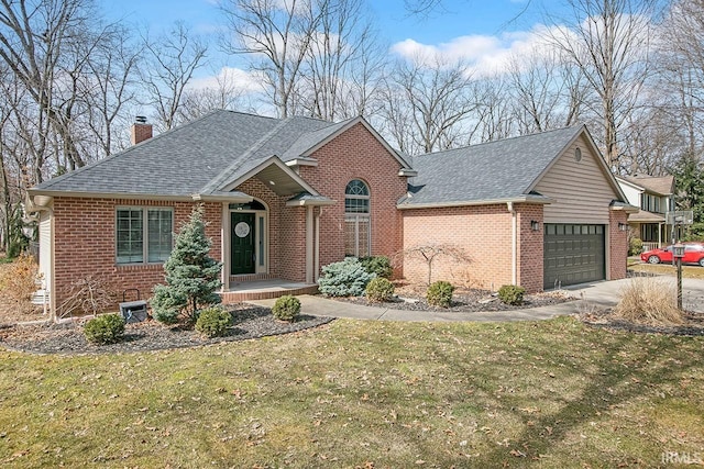 view of front of house with brick siding, a chimney, and a shingled roof