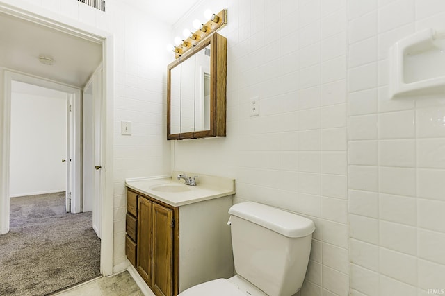 half bathroom featuring toilet and vanity