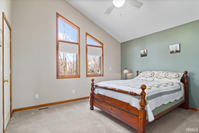 bedroom featuring visible vents, baseboards, carpet, and vaulted ceiling