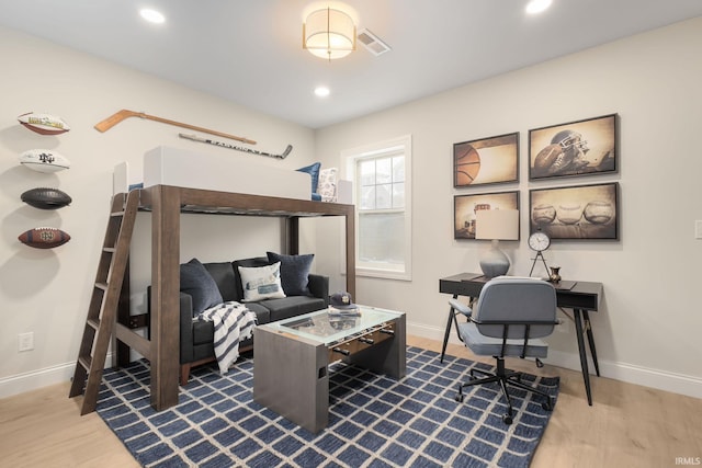 bedroom with recessed lighting, visible vents, baseboards, and wood finished floors