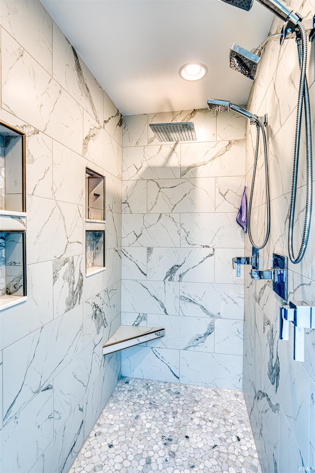 full bathroom with recessed lighting and a tile shower