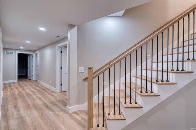 stairs featuring recessed lighting, wood finished floors, visible vents, and baseboards