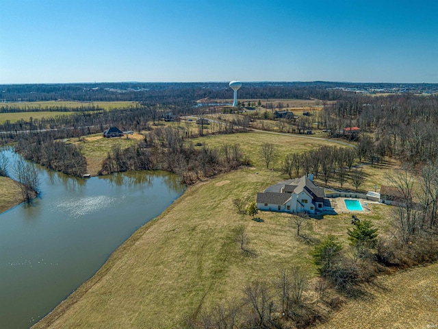 birds eye view of property with a water view and a rural view