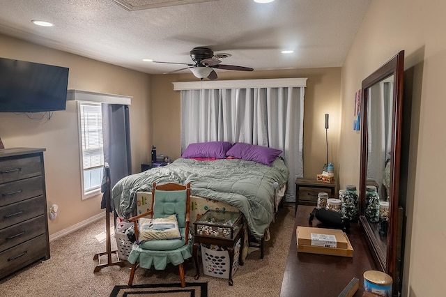 carpeted bedroom with recessed lighting, a ceiling fan, baseboards, and a textured ceiling