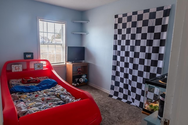 bedroom with carpet and baseboards