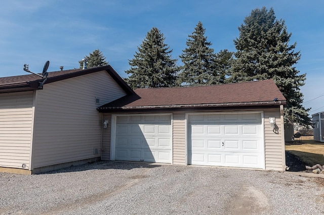 garage featuring driveway