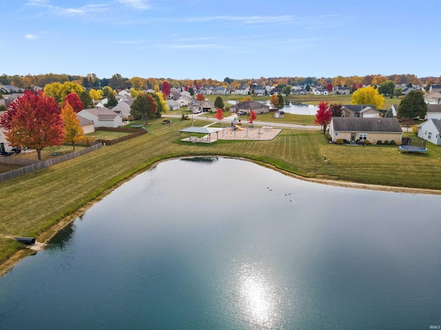 bird's eye view featuring a residential view and a water view