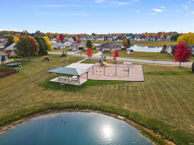 drone / aerial view with a residential view and a water view