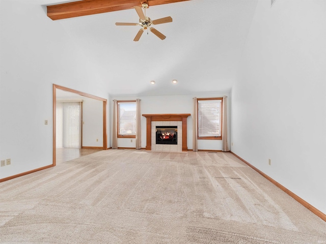 unfurnished living room featuring baseboards, high vaulted ceiling, a fireplace, light carpet, and beamed ceiling