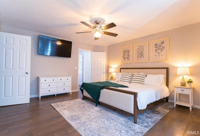 bedroom featuring a ceiling fan, wood finished floors, and baseboards