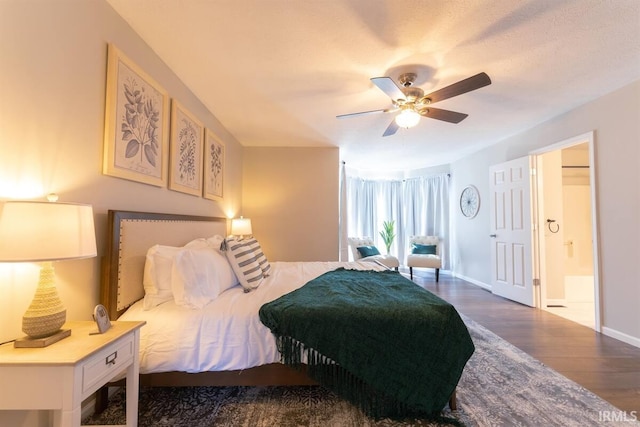 bedroom featuring ceiling fan, baseboards, and wood finished floors