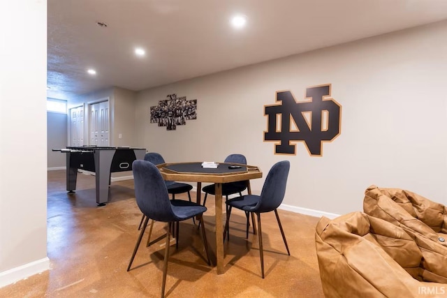 dining area featuring recessed lighting, baseboards, and concrete flooring