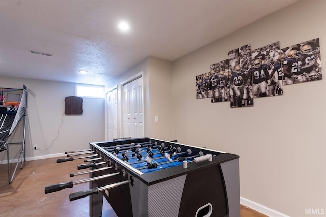 playroom featuring baseboards and visible vents