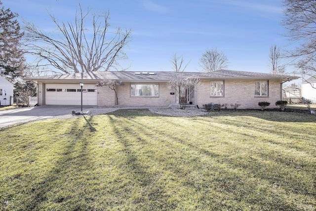 single story home with an attached garage, concrete driveway, and a front yard