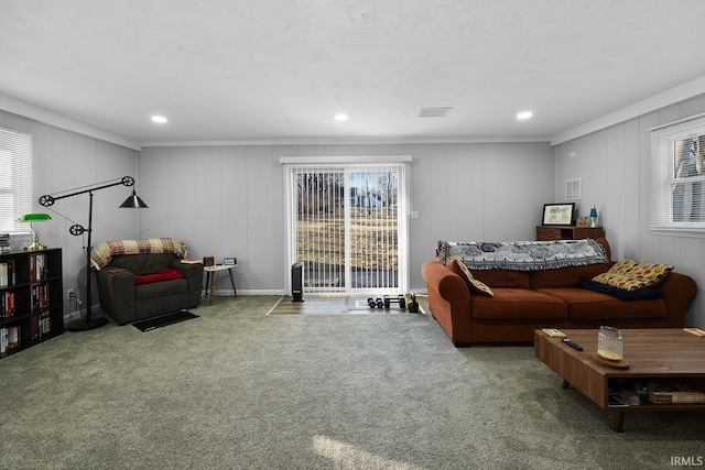 carpeted living area featuring recessed lighting and visible vents