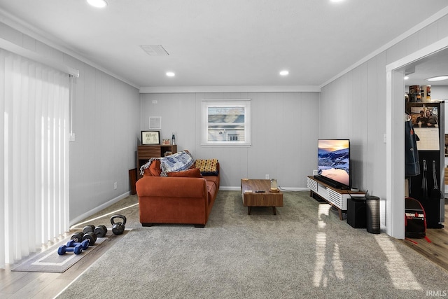 sitting room featuring visible vents, recessed lighting, crown molding, and wood finished floors