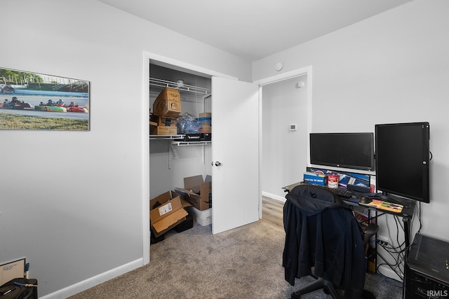 home office featuring carpet flooring and baseboards