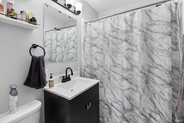 full bathroom featuring toilet and vanity