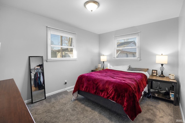 carpeted bedroom featuring baseboards