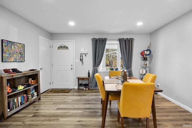 dining area featuring recessed lighting, baseboards, and wood finished floors