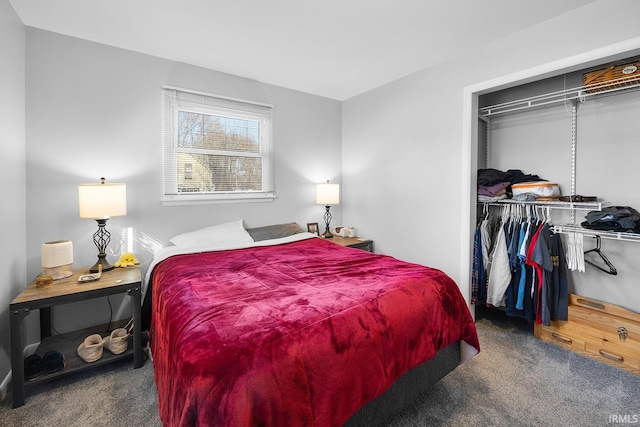 carpeted bedroom featuring a closet and a spacious closet