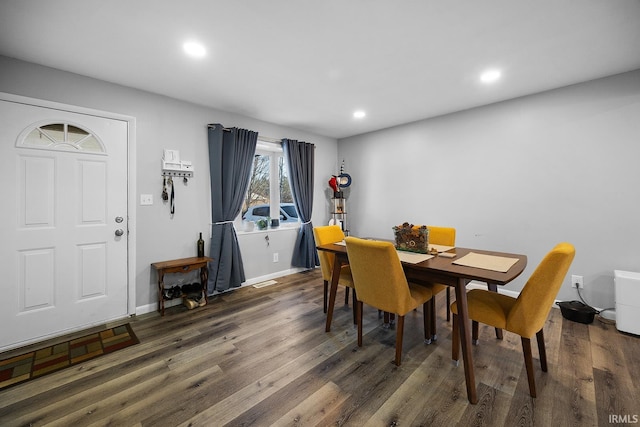 dining area featuring recessed lighting, wood finished floors, and baseboards