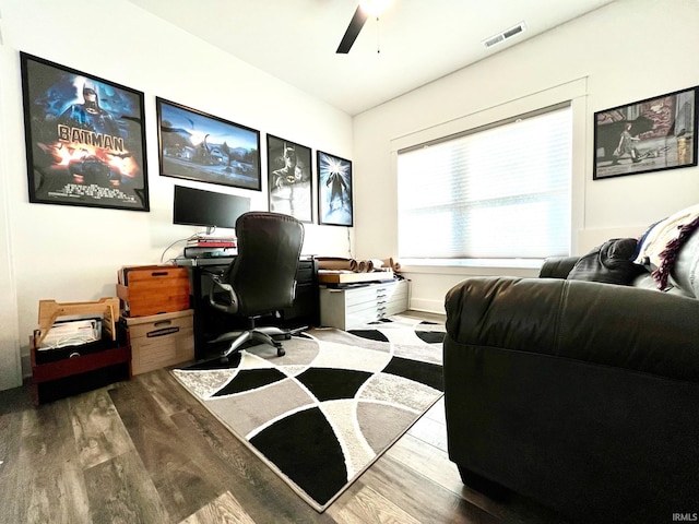 office with ceiling fan, visible vents, and wood finished floors