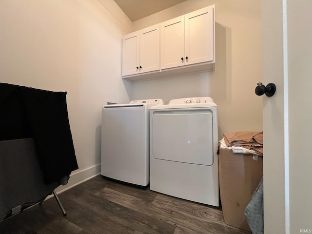 clothes washing area with dark wood-style floors, cabinet space, baseboards, and washing machine and dryer