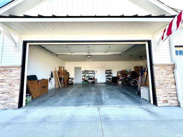 garage featuring concrete driveway