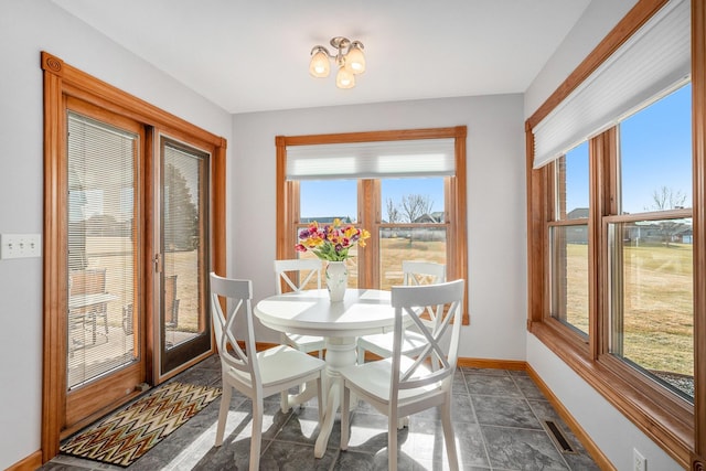 dining area featuring visible vents and baseboards